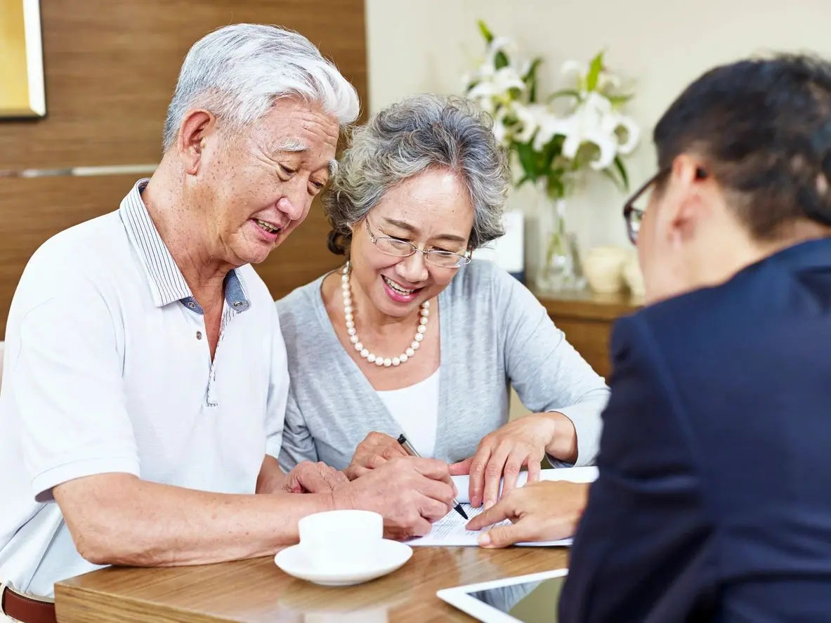 A couple of people sitting at a table